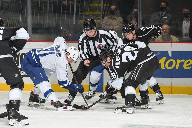 Chase Wouters takes a face off against the Ontario Reign in Abbotsford
